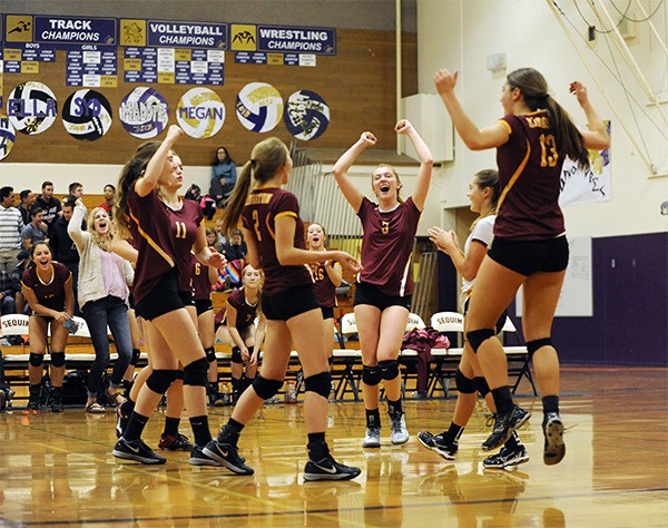 Kingston volleyball players celebrate after their 3-1 win over Sequim Oct.13.