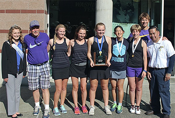 Danya Wallis (center) holds her trophy after finishing first in the 2A state tennis tournament. The North Kitsap team from left to right: (in purple) Steven Frease