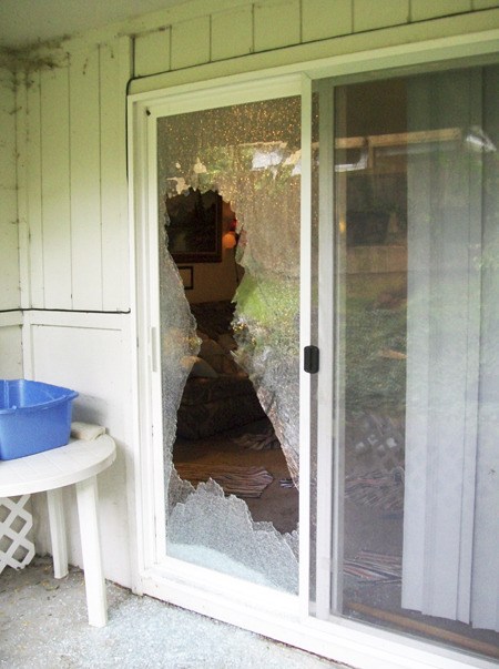 The sliding glass door was shot out at the rear of an apartment on Karcher Road where an armed man was in a standoff with Kitsap County deputies for a few hours Monday morning.