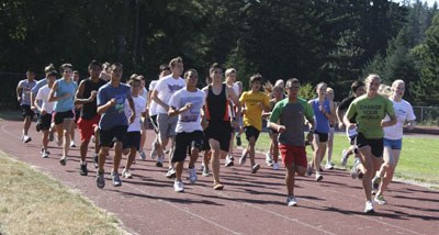 The Central Kitsap High School cross-country team warms up at a practice Aug. 19.