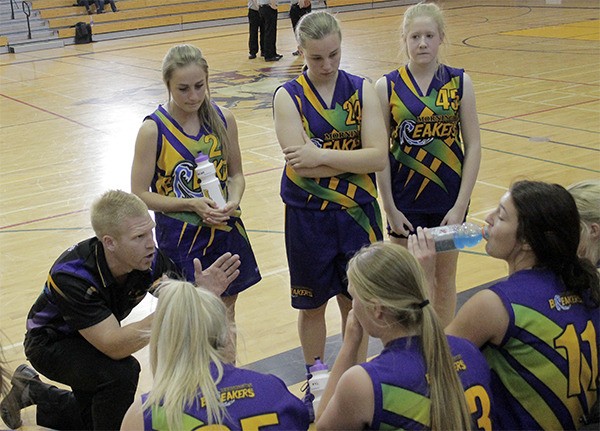 Mornington Breakers head coach Glenn Wansbrough talks to his club team of 16 and 17 year olds during a timeout Dec. 31 in the Kingston High School Gymnasium.