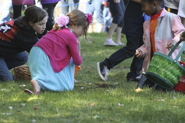 Kids scavenge for prizes and enjoy the egg hunt at Raab Park in 2012.