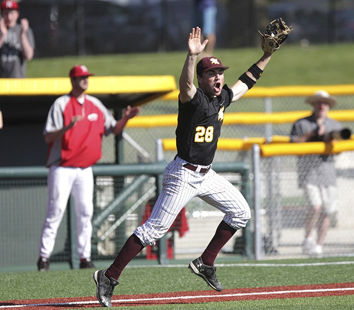 South Kitsap senior Mac McCarty celebrates the final out of the Wolves’ 5-2 win May 30 against Newport in the Class 4A state championship game at Bellingham’s Joe Martin Field.