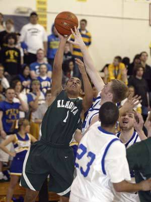 Klahowyas Andre Moore tries to hoist a jumper in Fridays 75-63 loss to the Fife Trojans. Moore scored a game-high 23 for the Eagles.