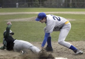Bremerton’s Derek Bennett lays the tag down on Klahowya’s Tony Livick for an out at last weekend’s jamboree.