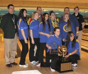 Tthe Bremerton girls bowling team poses with the state girls bowling trophy and plaque after taking first place last weekend at the 2008 WIAA 3A/2A State Girls Bowling Championships in Tacoma.