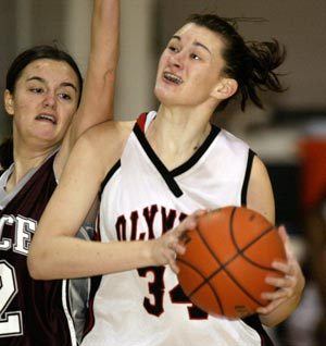 Olympic College and former Central Kitsap grad Dacotah Ettl gets fouled as she goes to the hoop against Pierce College on Dec. 22.