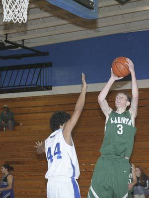 Klahowyas Chris Zumdieck fires a fading jumper over Olympics Andre Henderson in the Eagles 64-51 win on Tuesday at OHS.