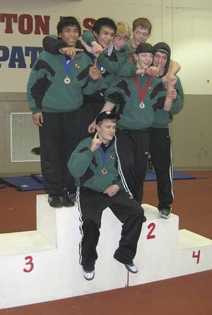 Klahowyas seven finalists pose with their medals as each played a major role in the teams regional title.
