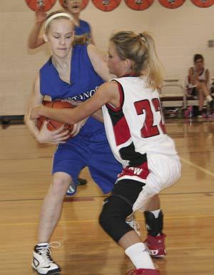 Kings West guard Irene Moore tries to wrestle a steal away from Rainier Christian on Wednesday.