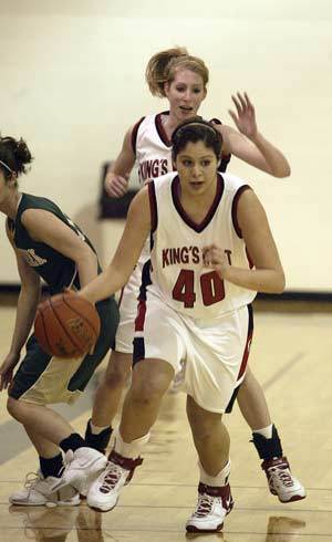 Warrior Megan Spence breaks to the basket after stealing the ball from a Bear Creek player.