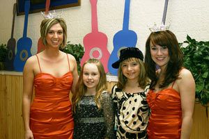 Miss Kitsap Megan Hornbuckle (far left) and Miss Poulsbo Alex Duchemin (far right) pose with Little Sisters Autumn Johnson