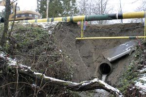 Mountain View Road was damaged last month after flood waters overwhelmed a concrete drainage pipe and undercut the road above it.