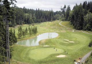 The 18th hole at Gold Mountain Golf Complex’s Olympic Course will prove a challenge for some of the top collegiate golfers in the nation as Gold Mountain prepares to host the NCAA Regionals.