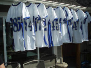 New uniforms were washed by Booster Dads Kevin Beliveau and Tim Calnan after the first game of the season.