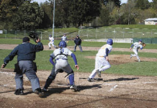 Bremerton’s Scott Burt sends a shot back to the mound during Wednesday’s  narrow 2-1 loss at the hands of North Mason .