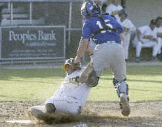 Kitsap’s Jake Owens slides into home during a game last year. He’ll be one of 12 returning BlueJackets in 2008.