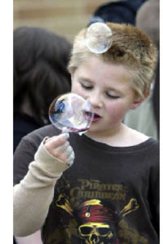A View Ridge Elementary School student checks out his bubble creation during the school’s Field Day activities Tuesday.