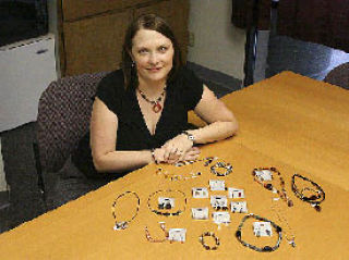 U Design Jewelry Representative Megan Howard shows off some of the pieces that can be made with U Design Jewelry. People can host home parties where they design their own jewelry.