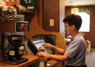 Longtime Family Pancake House waitress Irene Masterson completes an order on the Kitsap Way restaurant’s computer. Family Pancake House is celebrating 45 years in business next week.