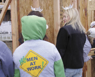 A diverse group of women — in tiaras and sweatshirts — participated in a ceremonial wall raising for the women’s build project in Bremerton sponsored by Habitat for Humanity on Monday.