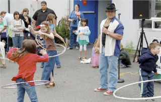 ‘Fred the DJ Guy’ had the kids gathered at the Port Orchard Library’s ‘Ants in Your Pants’ dance party hula hooping