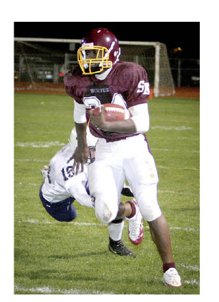 South Kitsap running back Ryan Williams busts loose for a long gainer against Bellarmine Prep on Friday night.