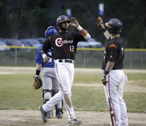 Caleb Brown scores a run in Tuesday’s 17-2 win against Olympic. Brown verbally committed to UW for baseball.