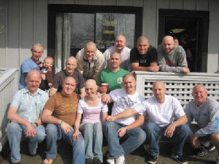 Miranda Stokke (bottom center) poses for a photo with her Silver City Restaurant & Brewery coworkers