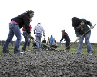 Central Kitsap High School students helped the Clear Creek Task Force build 500 feet of connecting trail in the Clear Creek Valley Thursday.