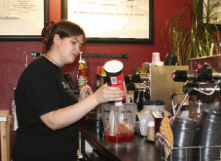 Kataluma Chai manager Callie Hall makes a fruit smoothie for a customer. Kataluma Chai has 180 flavors of chai and makes other drinks as well.