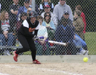 Central Kitsap’s Brittany Woolford drives a grounder in Friday’s 5-4 loss to Kentlake