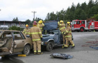 Local firefighters demonstrate vehicle extrication Saturday at the Kitsap County Fairgrounds. The live demonstration was just one of many activities at Kids’ Day.