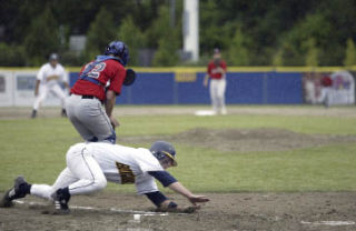 Kitsap catcher Lawson Hipps slides into home during the BlueJackets’ 7-6 loss to Tacoma on Wednesday in the team’s home opener. Kitsap fell 8-1 Thursday against Corvallis (Ore.).