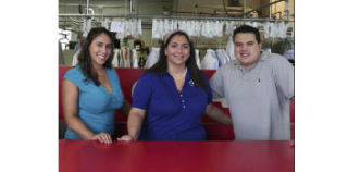Zahra Akhgar (center) owns Ultra Custom Cleaners in Silverdale and her sister Mariam Akhgar (left) and husband Gerald Hixon help out at the family business.