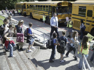 Cougar Valley Elementary School students head to their buses during the first week of school last year.
