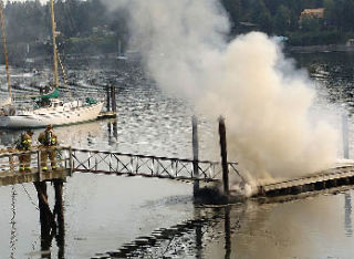 Navy Region Northwest Keyport firefighters joined forces with Poulsbo Fire Department and North Kitsap Fire and Rescue in responding to a waterfront dock fire