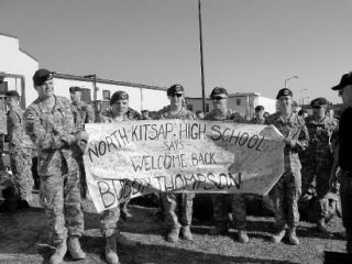 2004 NKHS graduate Bobby Thompson (center) ends his service after three years in the U.S. Army.