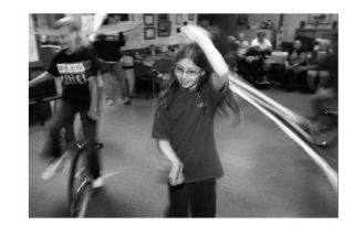 Breidablik Elementary School fifth grader Kristy Young performs with the poi during a recent BRATS performance at the Poulsbo Senior Center.  The BRATS troupe is an acrobatic arm of the school’s athletic program which performs periodically throughout the North Kitsap community.