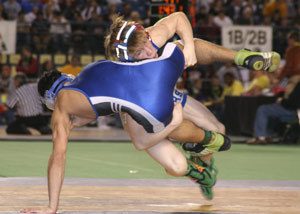 130-pound champion Branden Yeik leaves the mat in taking down Ferndales JJ Resier in the title match.