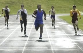 Olympic’s Larry Dixon finished first in the 200-meter dash in his heat in the event Bremerton’s Alex Griffin won at the Kitsap County Classic on March 15.