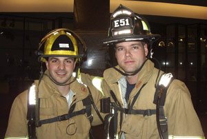 CKFR firefighters Brock Shaffer (left) and Greg Snyder pose for a photo before climbing to the top of Columbia Center in Seattle at a past Scott Firefighter Stairclimb.
