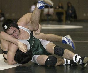 Klahowya 171-pounder Donny McCarty wraps up Glen Calnan of Bremeton en route to an 8-5 win on Wednesday.