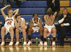 Central Kitsaps bench reacts to the final moments of the Cougars 54-49 loss to Lincoln in the Narrows League tourney Thursday.
