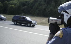 Washington State Patrol Trooper Eric Ludlow clocks drivers speeds on State Route 3. WSP