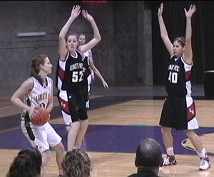 Kings Wests Breyenne Mosey (52) and Megan Spence (40) apply pressure to a Liberty Bell ball handler at the state 2B tournament