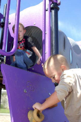 Crown Hill Elementary students play on phase one of the school’s new playground equipment Sept. 15.