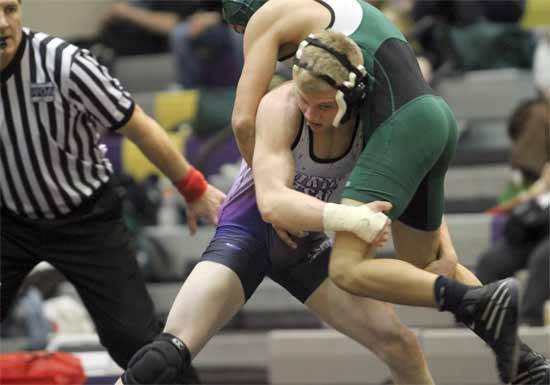 North Kitsap’s Jake Sievers prepares to slam Port Angeles’s Ozzy Swaggerty to the mat Wednesday during a home meet.  Sievers