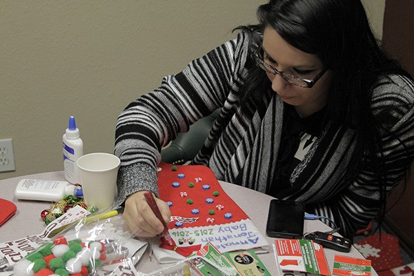 Annalees Hern designs a Christmas stocking Dec. 4 at The Coffee Oasis during Late Night