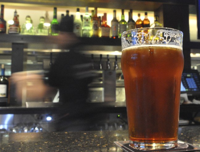 A server at the Silver City Brewery moves fast